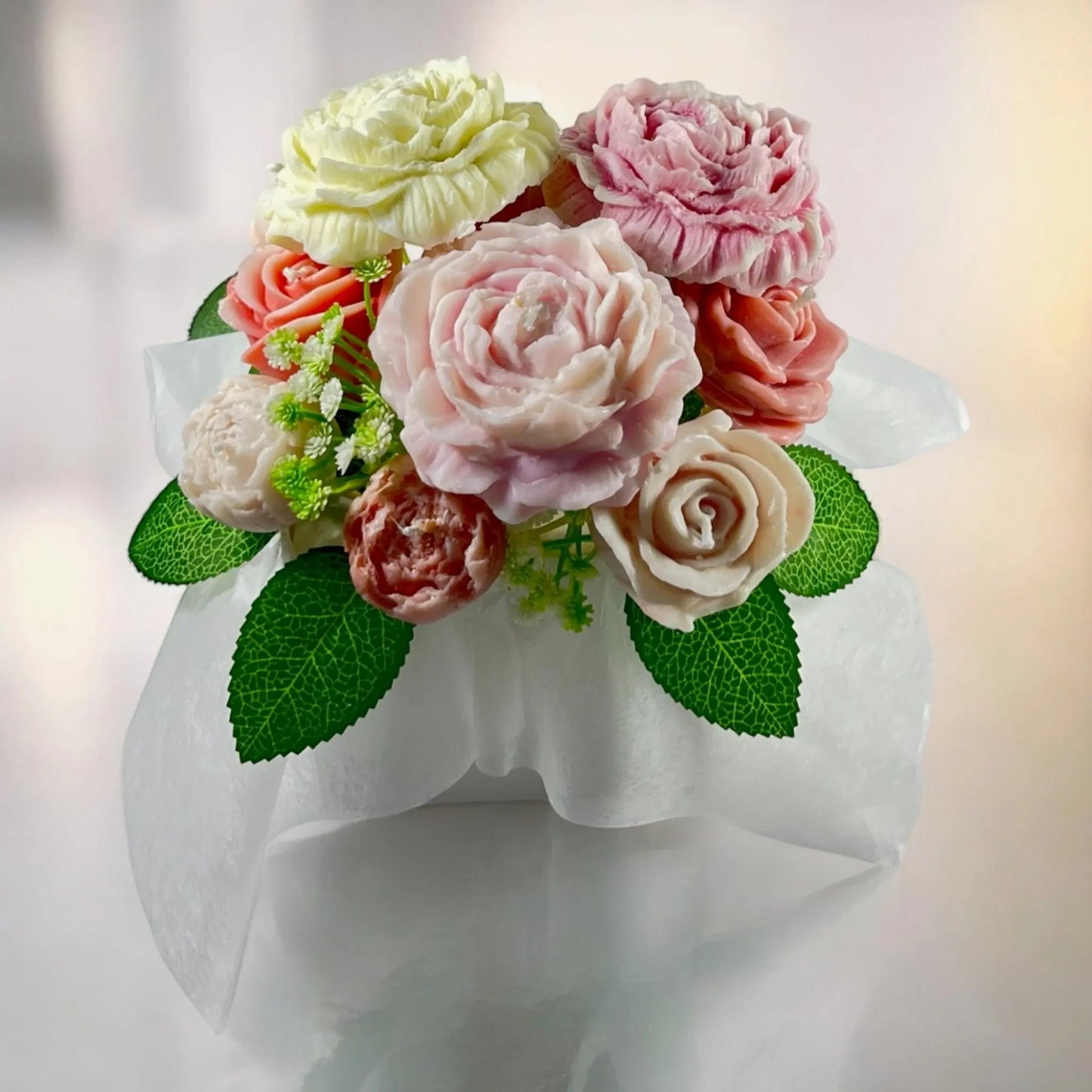 Sophisticated floral arrangement in a beautifully adorned gift box.