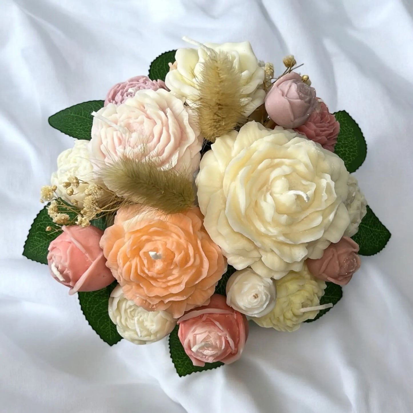 Handcrafted candle bouquet in an artistic decorative pot.