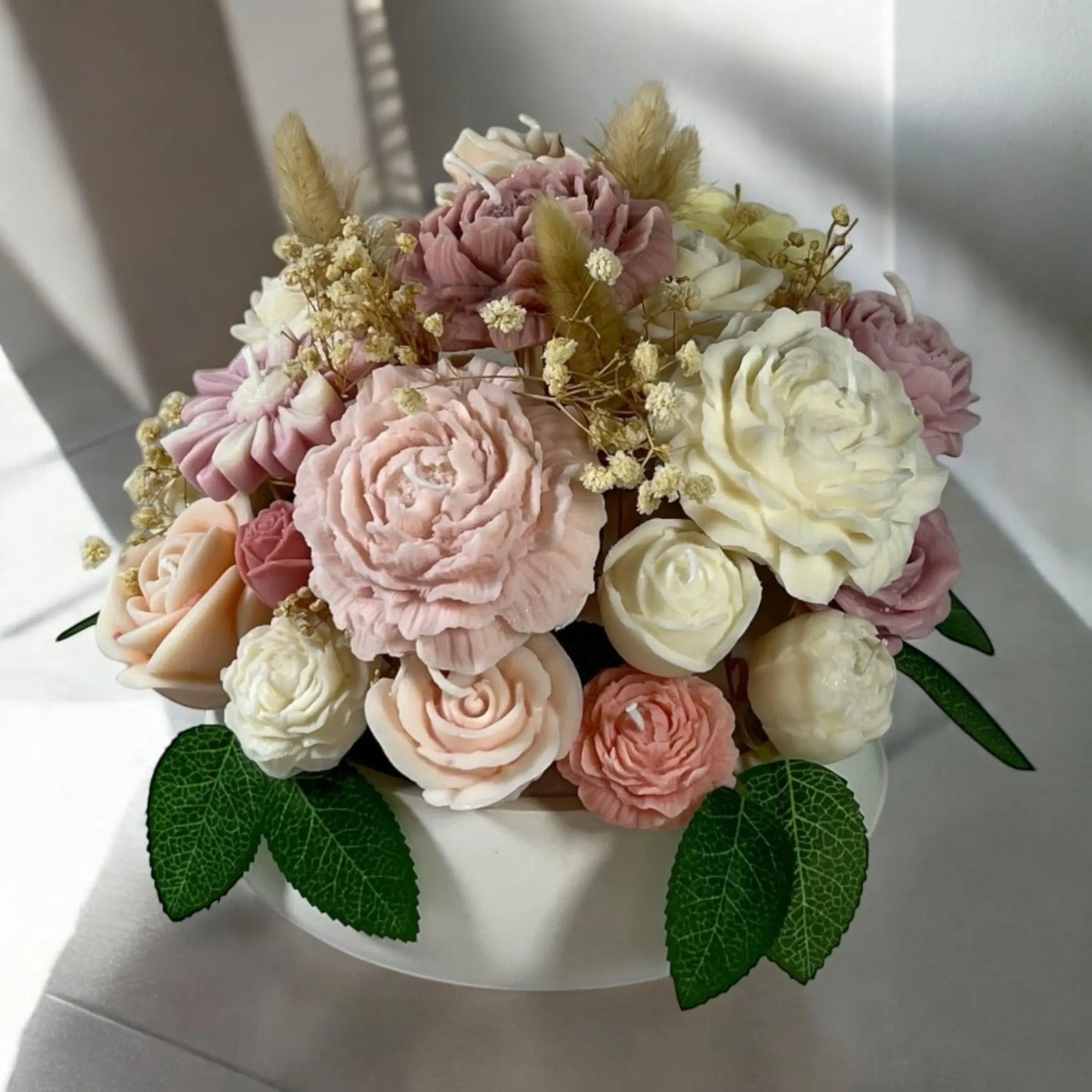A perfect home décor accent – floral candle bouquet in a chic pot.