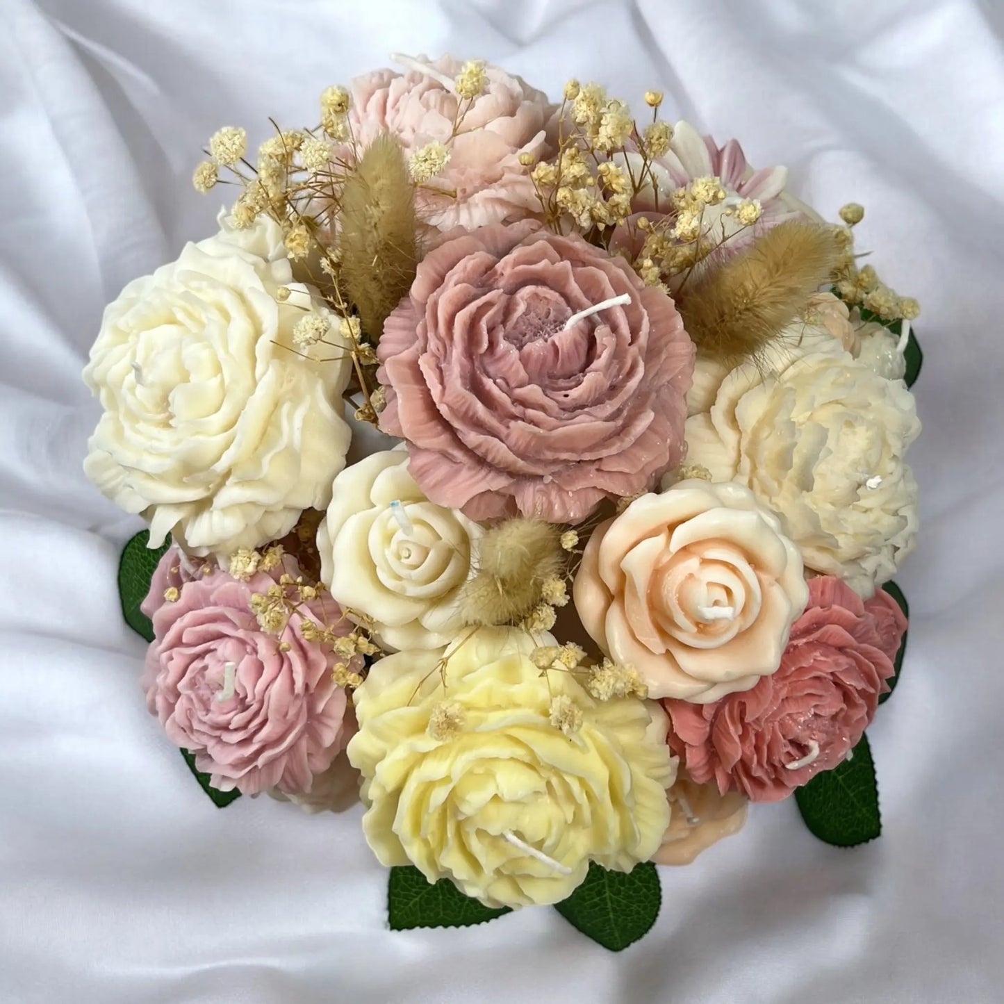 Hand-sculpted candle flowers arranged in an elegant pot.