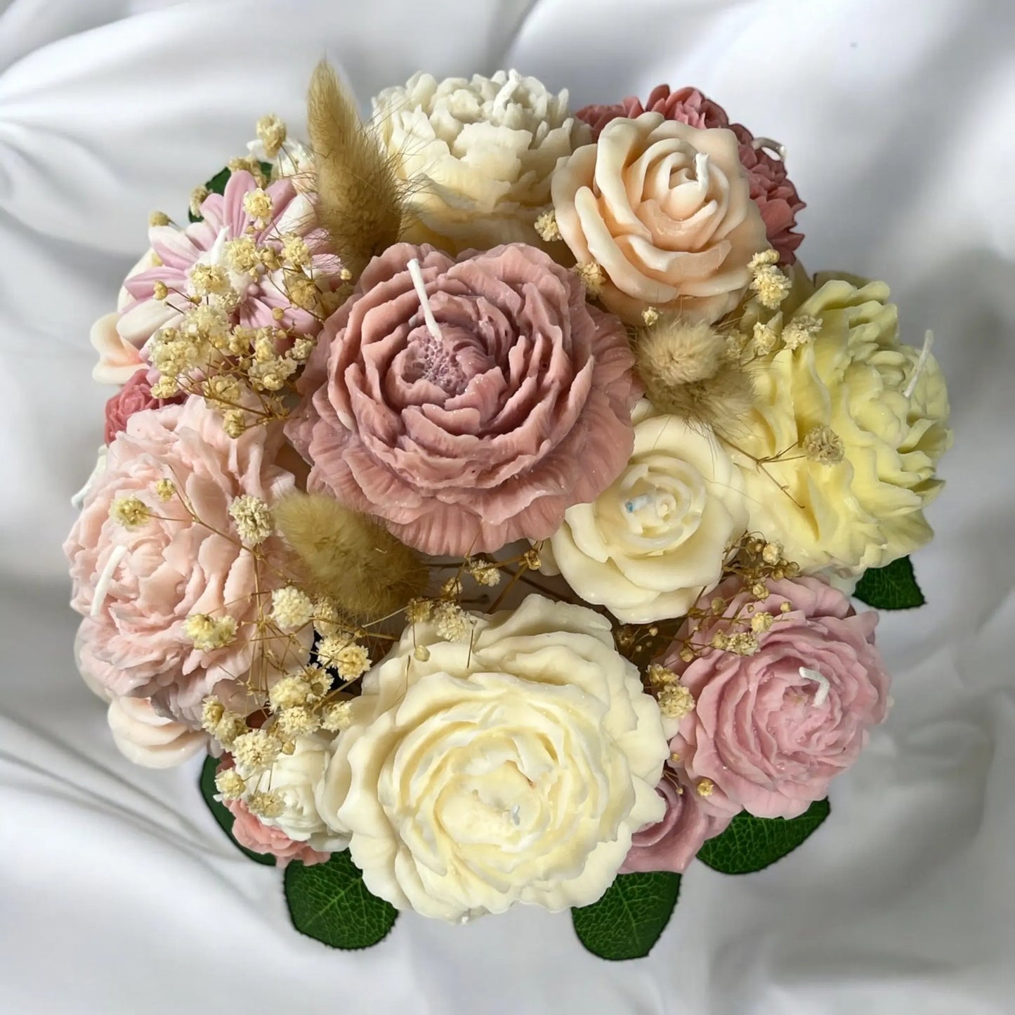 Timeless candle bouquet centerpiece in a refined decorative pot.