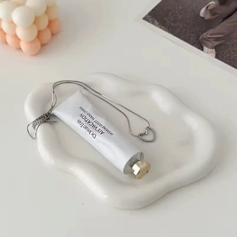 Trendy tray for candles and decor, ideal for stylish home accents.