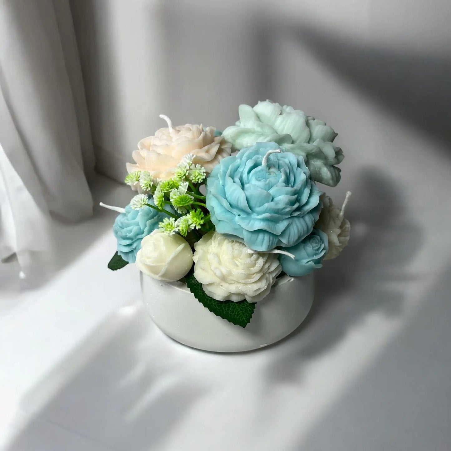 Unique floral candle arrangement for home styling.