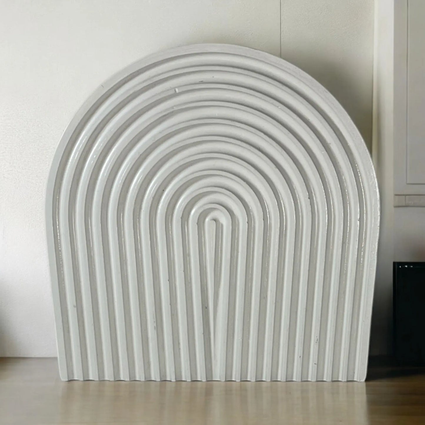 Functional and stylish arched tray for organizing accessories.