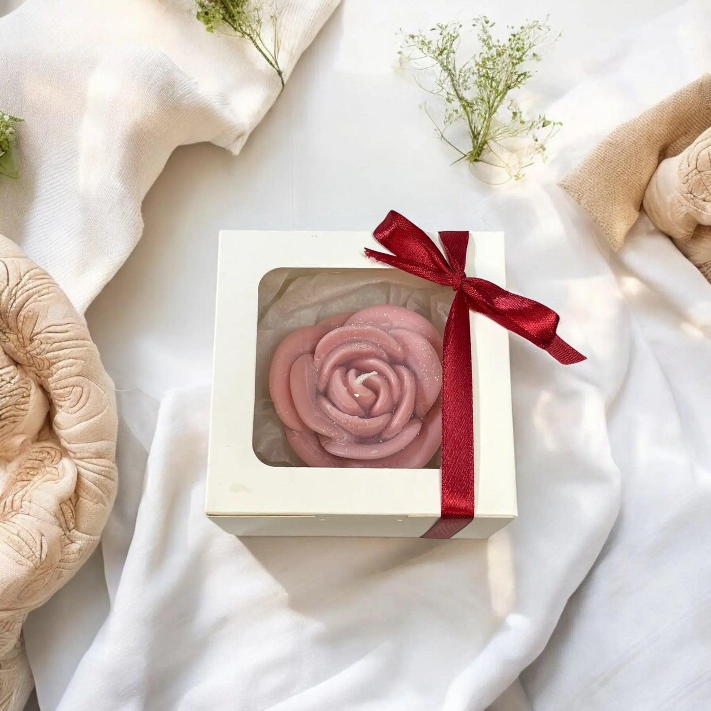 Eco-friendly soy candle shaped like a rose in gift packaging