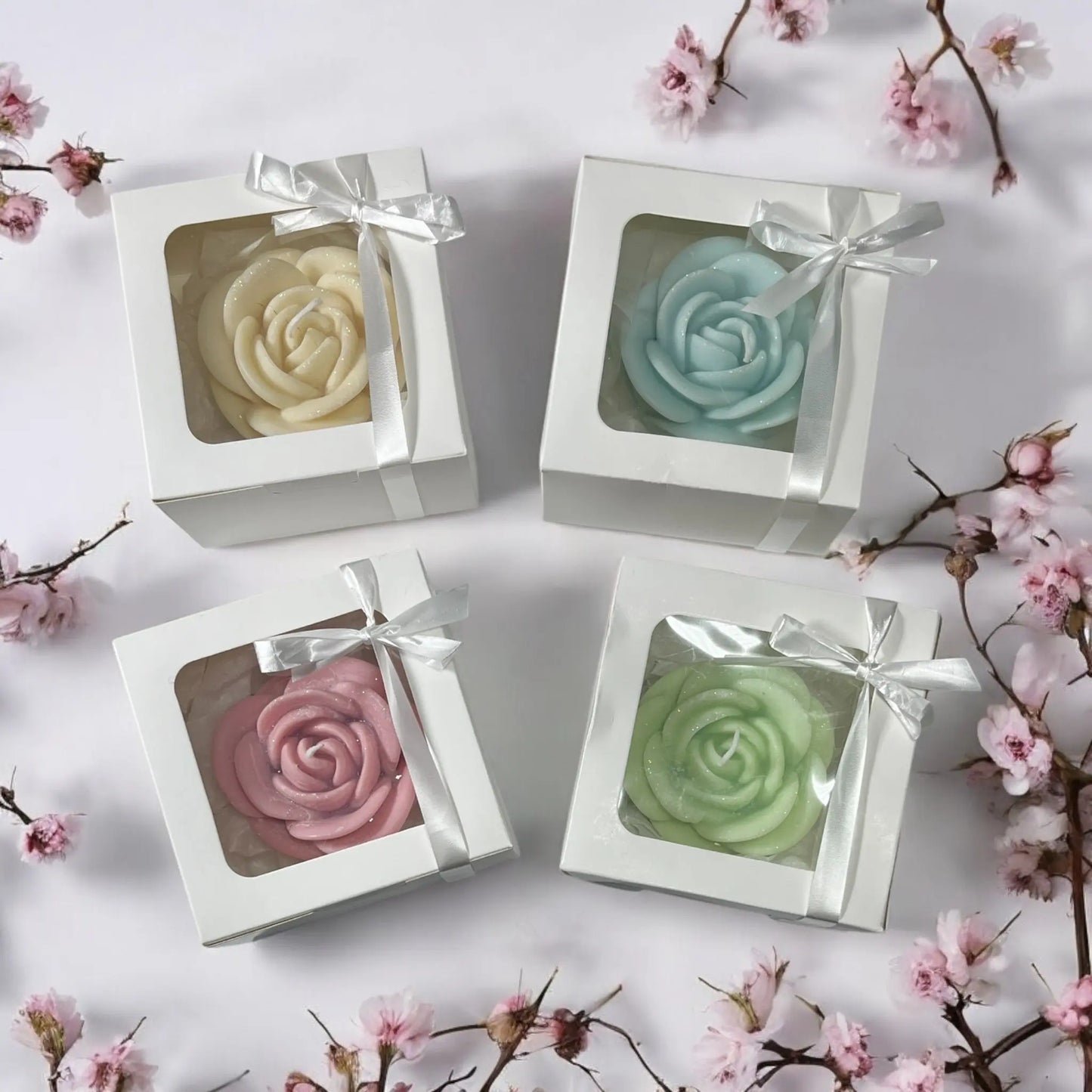 Delicate floral candle presented in a stylish gift package.