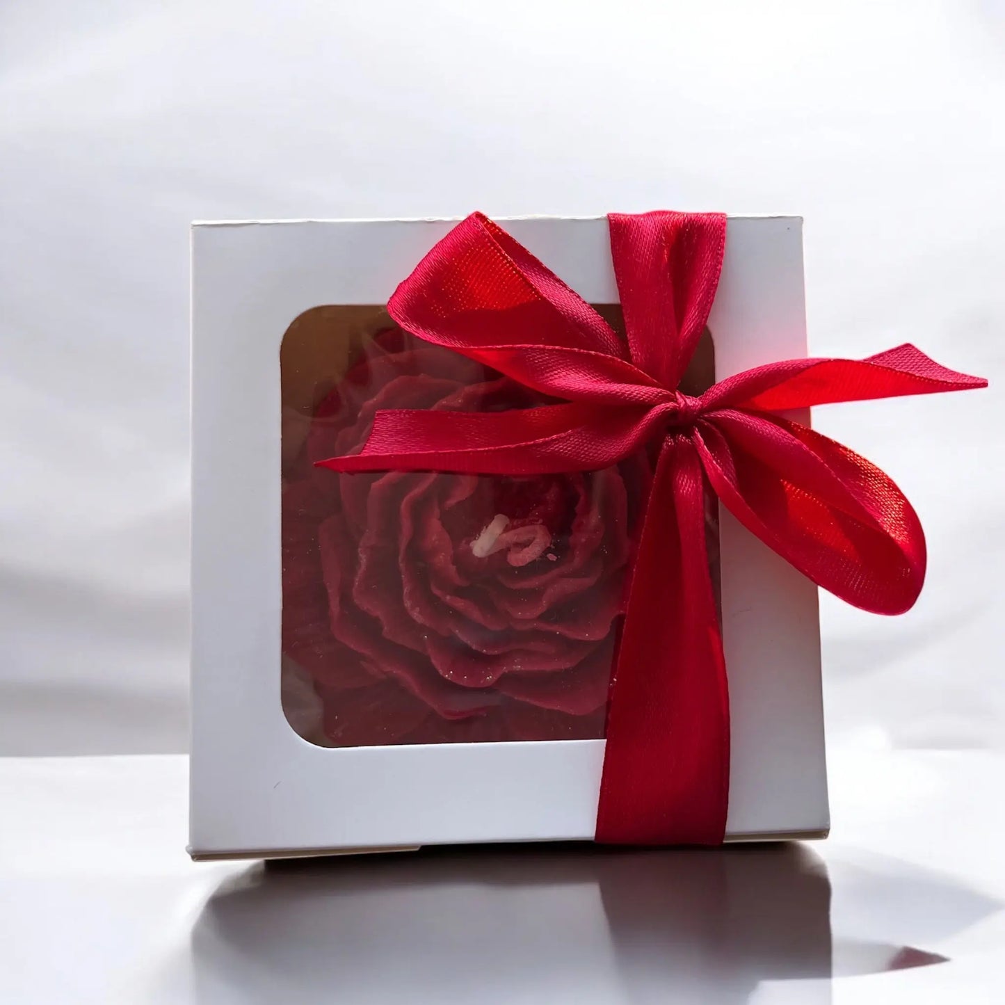 Beautifully sculpted red rose candle for special occasions.