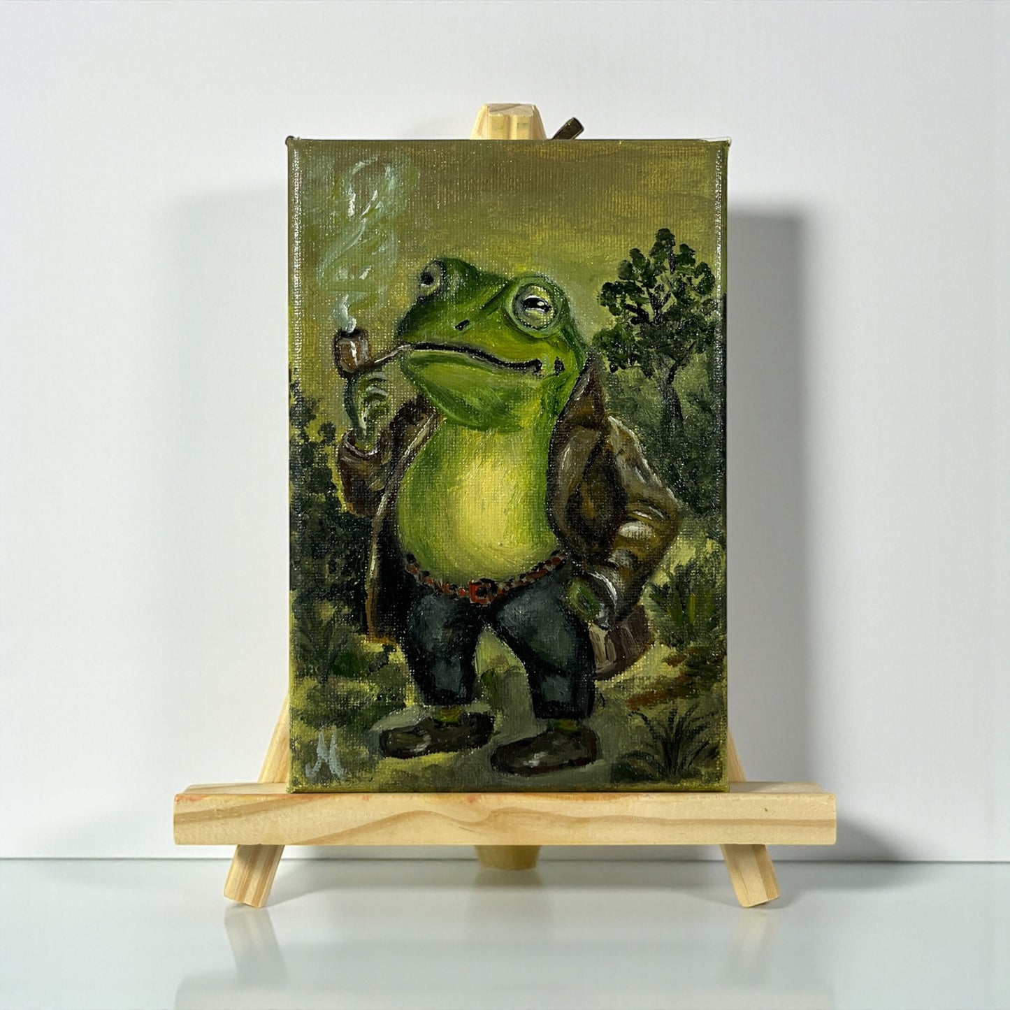 Alkuperäinen öljymaalaus sammakosta piipun kanssa metsässä, Froggies-sarja