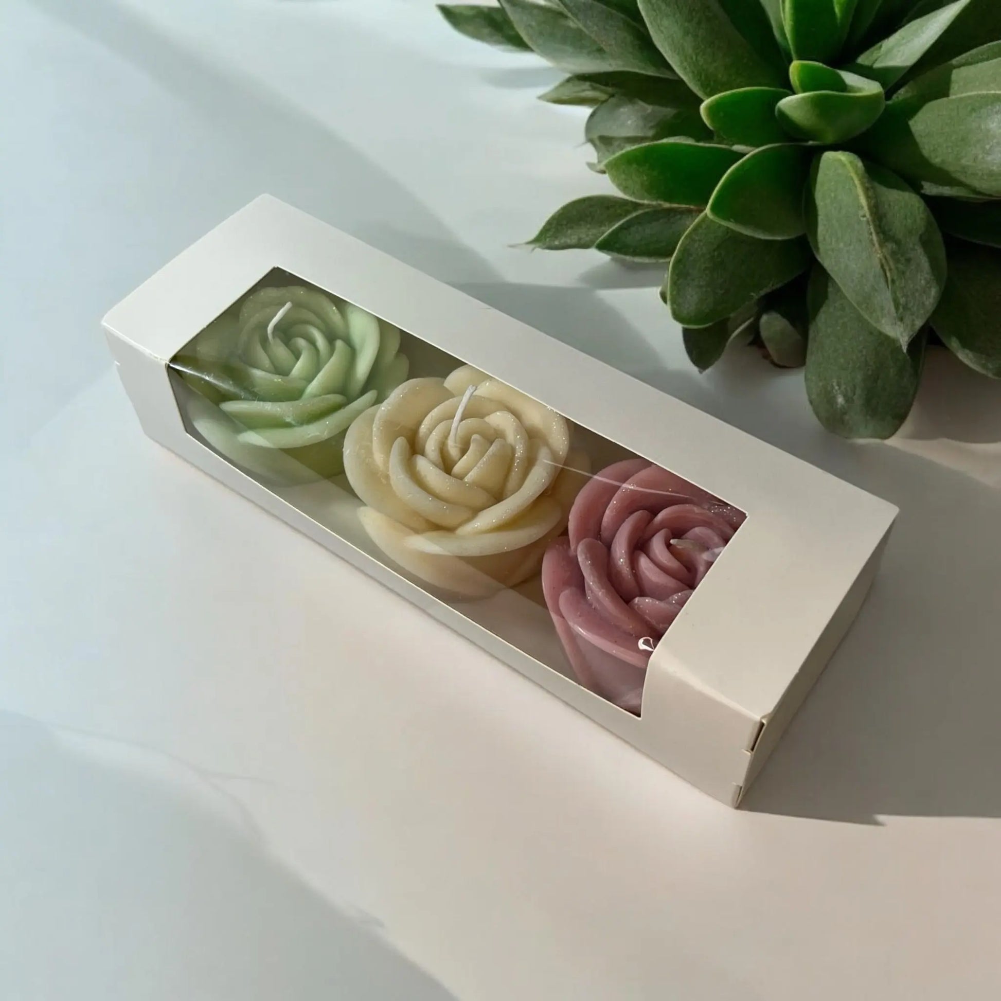 Handcrafted red rose candle in an elegant gift box.