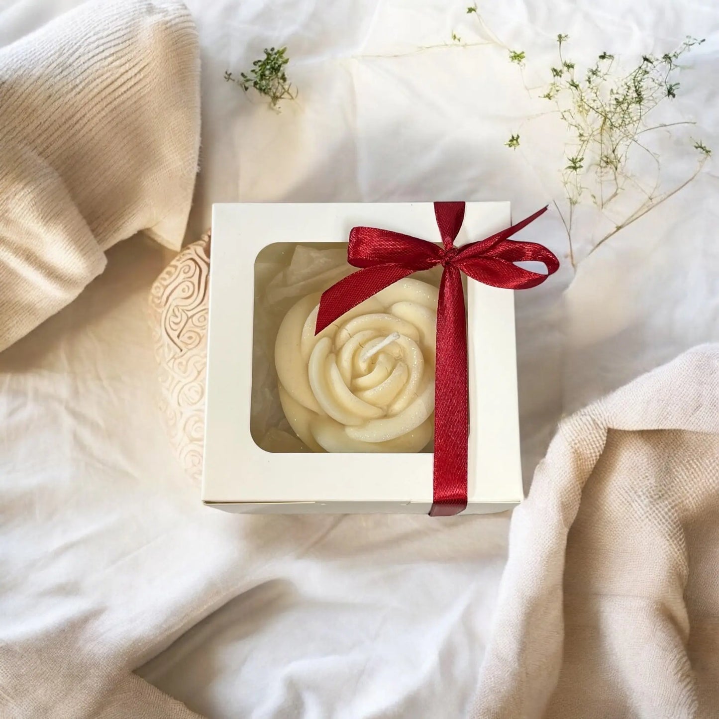 Elegant rose candle presented in a decorative gift box