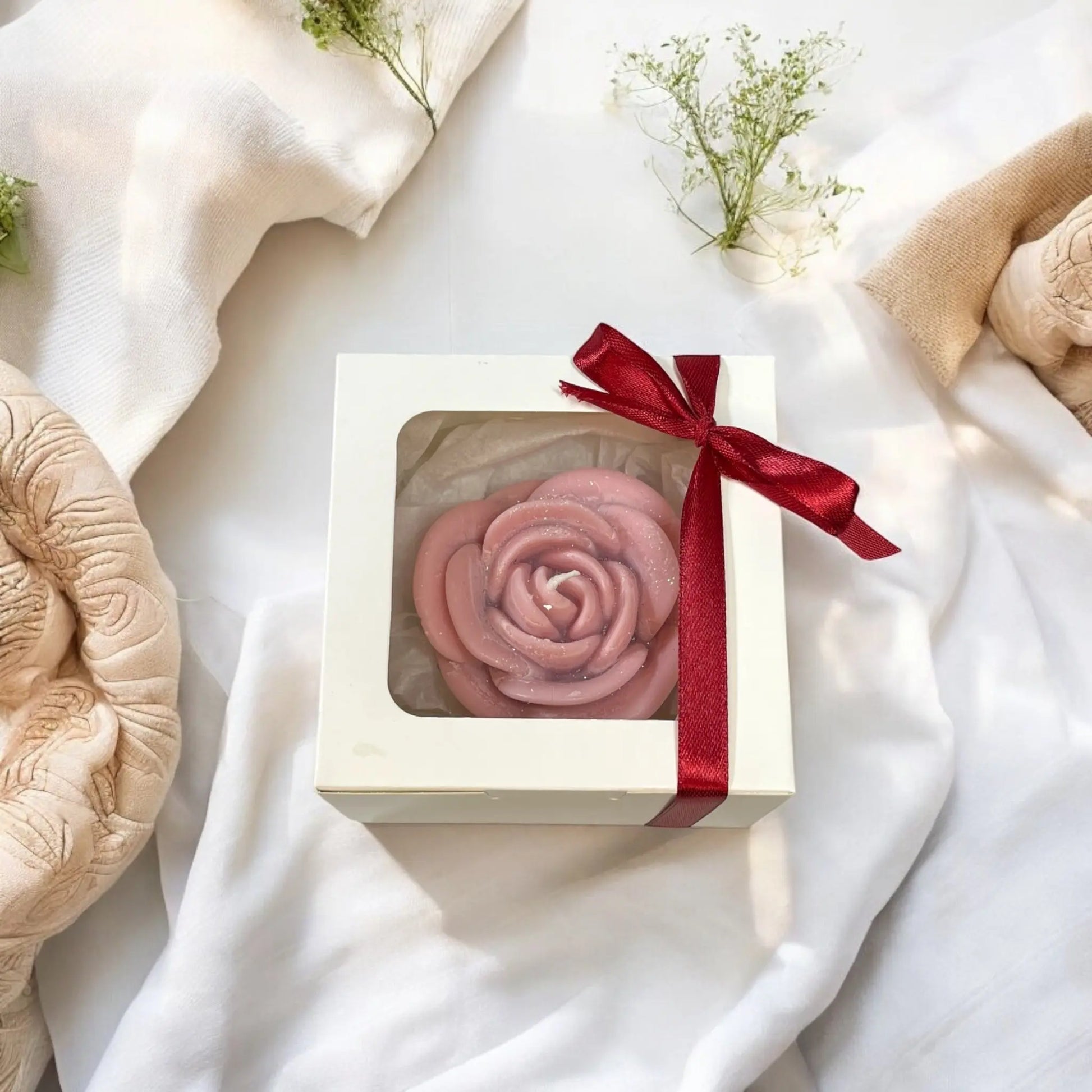 Eco-friendly soy candle shaped like a rose in gift packaging