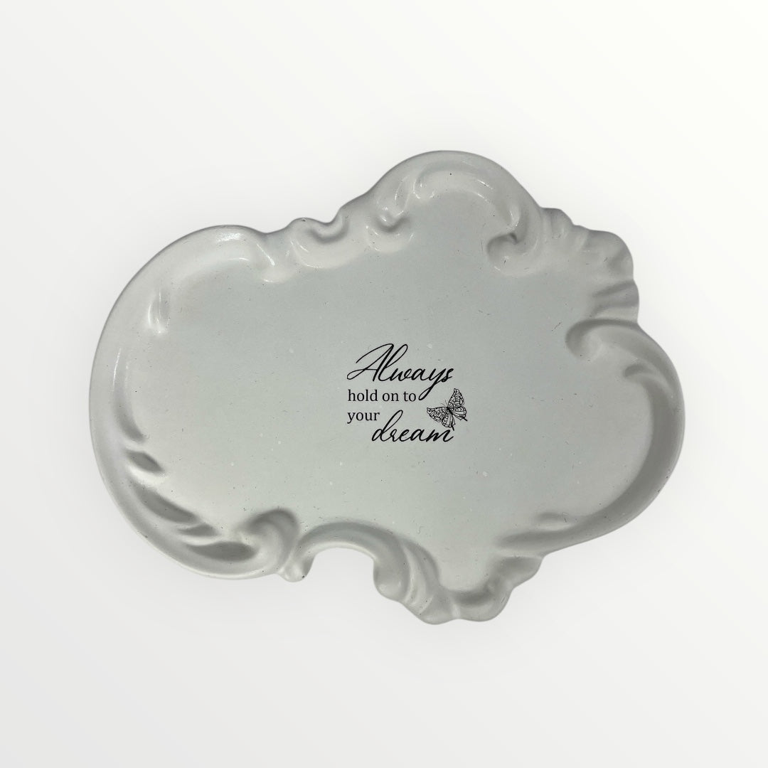 Käsintehty kipsinen kynttilänalusta tekstillä Always hold on to your dream