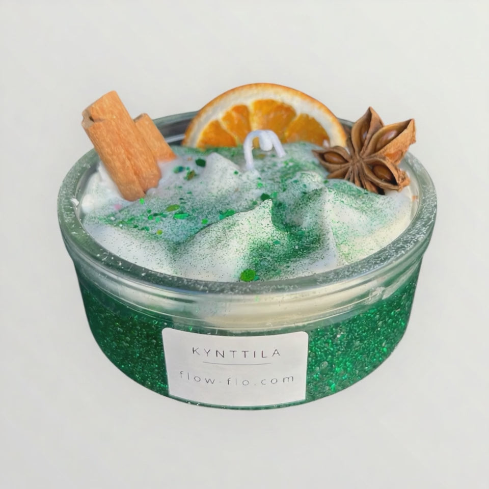 Kaneli ja kuivattu appelsiini kynttilän koristeena – käsintehty